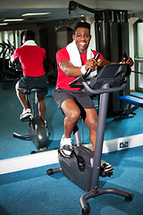 Image showing Athletic young man at the gym