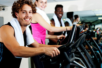 Image showing People at gym working out happily