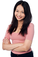 Image showing Pretty asian girl posing casually, arms folded