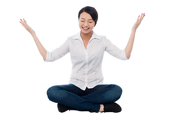 Image showing Pretty girl practicing meditation smilingly