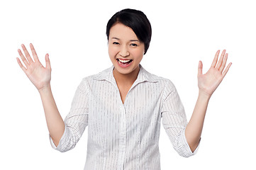 Image showing Cute girl laughing heartily with open hands