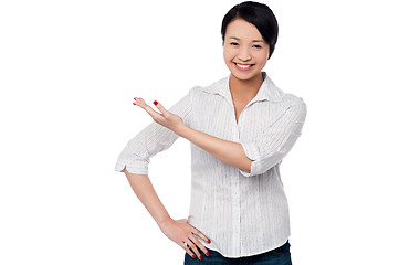 Image showing Pretty casual woman directing the way