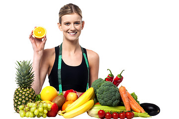 Image showing The beautiful girl with fruits and vegetables
