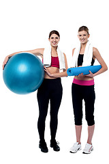 Image showing Two fitness girls posing after workout