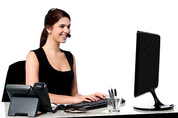 Image showing Call centre executive working on computer