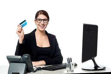 Image showing Attractive businesswoman holding credit card