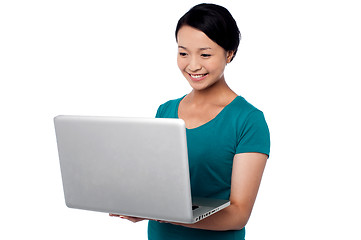 Image showing Young girl working on laptop