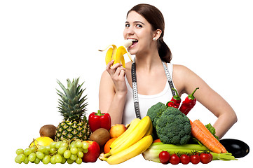 Image showing Healthy caucasian girl eating banana