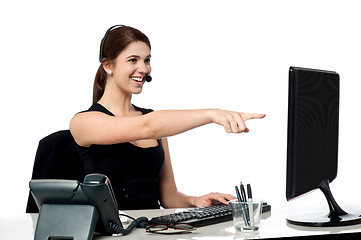 Image showing Female executive pointing at computer screen