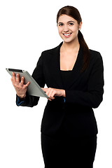 Image showing Attractive businesswoman working on touch pad