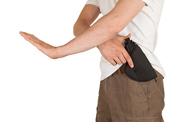 Image showing Close-up of a man with holster and a gun