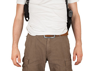 Image showing Close-up of a man with holster and a gun