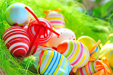 Image showing Colorful painted easter eggs in basket 