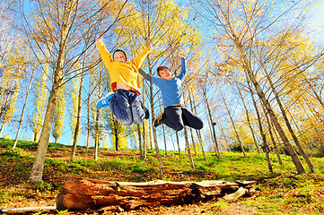 Image showing two boys jumping