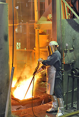 Image showing worker with hot steel