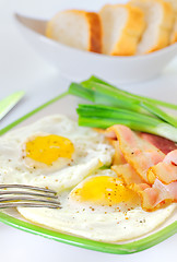 Image showing breakfast with bacon and fried eggs 