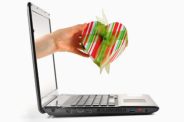 Image showing gift come out from a screen of a laptop 
