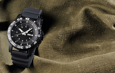 Image showing military watch on sack background