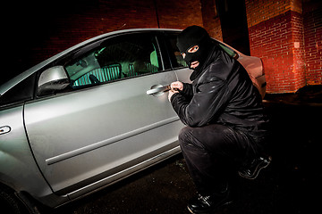 Image showing Car thief in a mask.