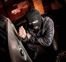 Image showing Car thief in a mask.