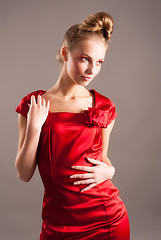 Image showing sexy young blond woman in red