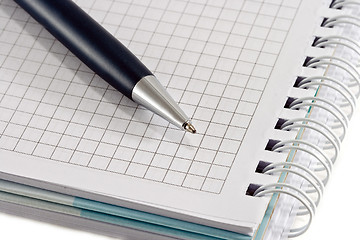 Image showing Blue pen with notebook closeup