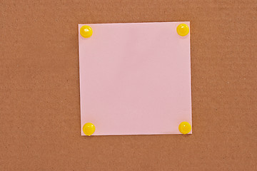 Image showing Pink note paper attached with yellow pins