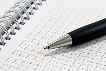 Image showing Ballpoint pen on checked notebook paper