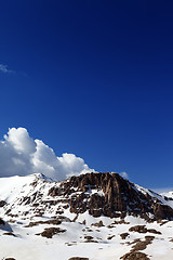 Image showing Rocks in snow and blue sky