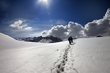 Image showing Two hikers on snow plateau