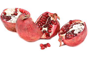 Image showing Halved pomegranates isolated on white background