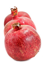 Image showing Ripe pomegranates isolated on white background