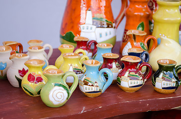 Image showing various colorful clay handmade jug jar sell market 