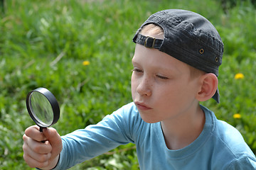 Image showing the teenager with a magnifying glass