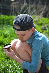 Image showing the teenager with a magnifying glass