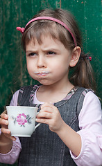 Image showing Child drinking milk