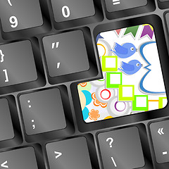 Image showing Spring floral design element. Birds, flowers on computer keyboard key