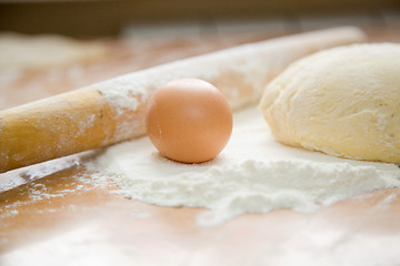 Image showing egg and dough