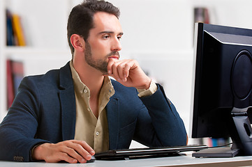 Image showing Man Looking At A Computer Monitor