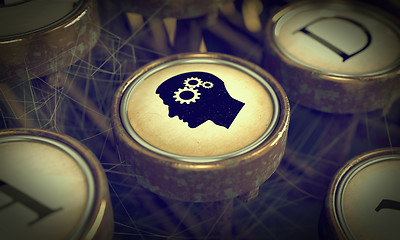 Image showing Head With Gears on Grunge Typewriter Key.