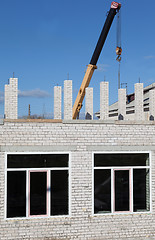 Image showing Building a house of gray bricks