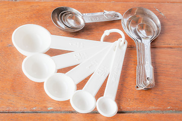 Image showing Many types of bakery  measuring spoons on wood table