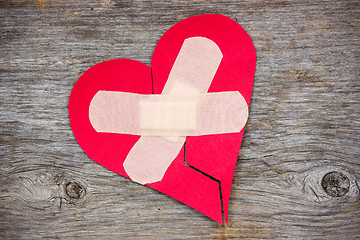 Image showing Broken heart on the wooden background