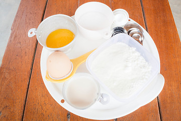 Image showing Set of baking ingredients with measure spoon 