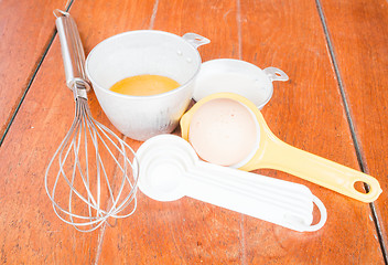 Image showing Step of bakery preparation with milk, butter, spoon, hand mixer 