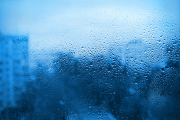 Image showing Natural drops of water on window glass