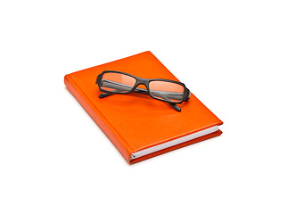 Image showing Orange book and glasses, isolated on white background