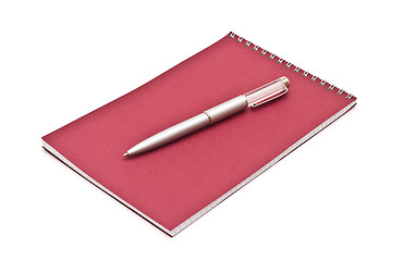 Image showing Notebook with silver pen, isolated on white