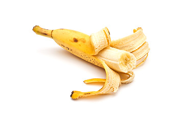 Image showing Half-peeled banana on white background