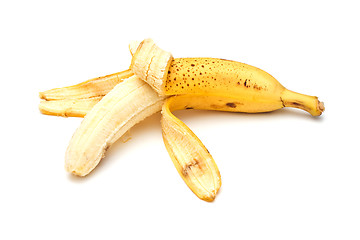 Image showing Half-peeled banana on white background